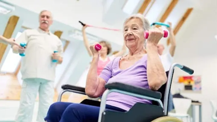 senior woman doing exercises in wheelchair